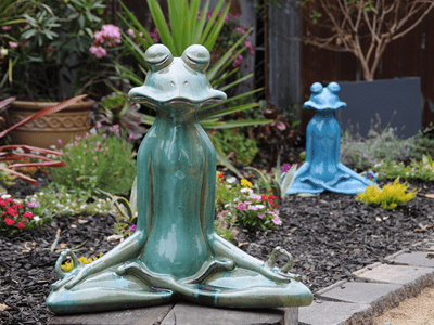 green meditating frog
